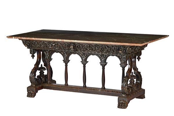 A Victorian centre table, the rectangular marble top on a carved oak two drawer base with double opposing scroll supports on paw feet, 180cm wide x 75