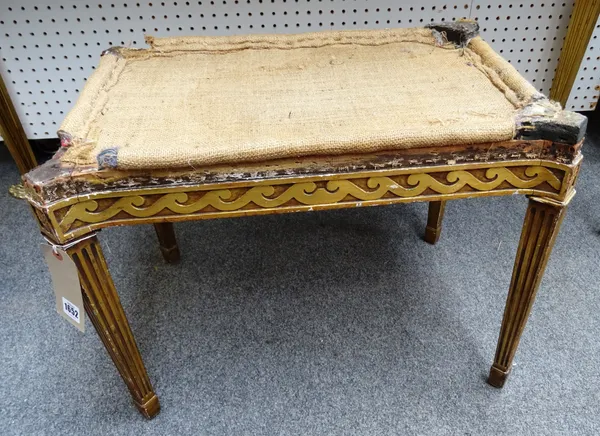 A mid-18th century style gilt framed footstool, with wave carved frieze on tapering square supports, 60cm wide x 44cm high x 40cm deep.