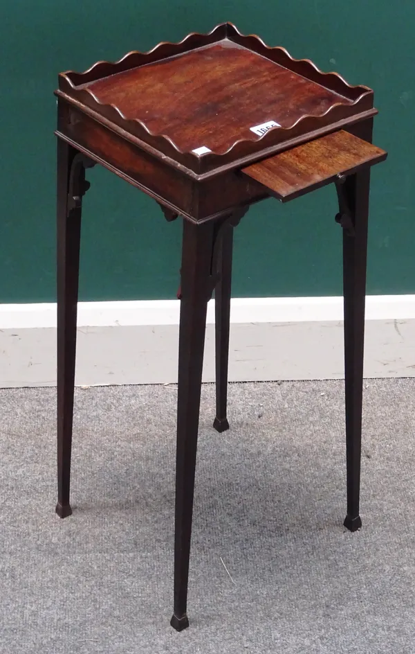 A George III mahogany candle stand, the wavy gallery over pull-out candle slide on tapering square supports, 31cm wide x 65cm high.