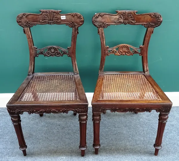 A set of six mid-19th century Anglo-Indian carved rosewood framed dining chairs, with cane work seats, each 49cm wide x 90cm high, (6).
