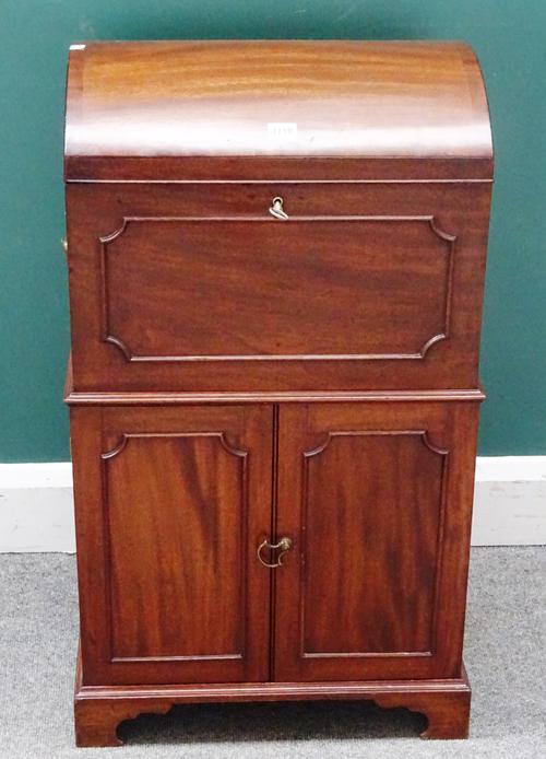 A George III mahogany domed top cellarette on two door cabinet on bracket feet, 47cm wide x 85cm high x 37cm deep.