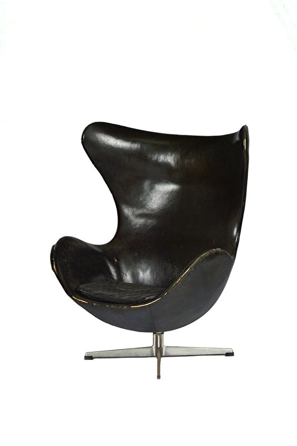 Arne Jacobensen for Fritz Hansen; a mid-20th century black leather upholstered 'Egg chair', on a steel four point base, 81cm wide x 105cm high. Illust