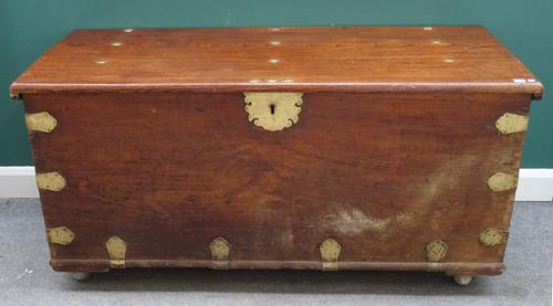 A large 19th century Indian brass bound teak rectangular lift top trunk, 160cm wide x 67cm high x 69cm deep.
