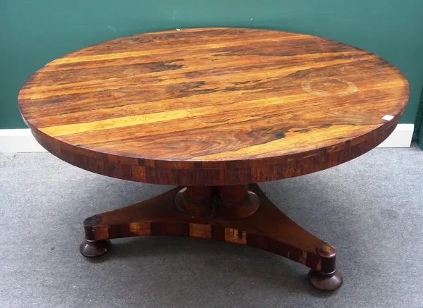 Johnstone Jupe & Co New Bond St London 4035; a William IV rosewood centre table, the circular snap-top on bluster column and triform platform, 138cm d