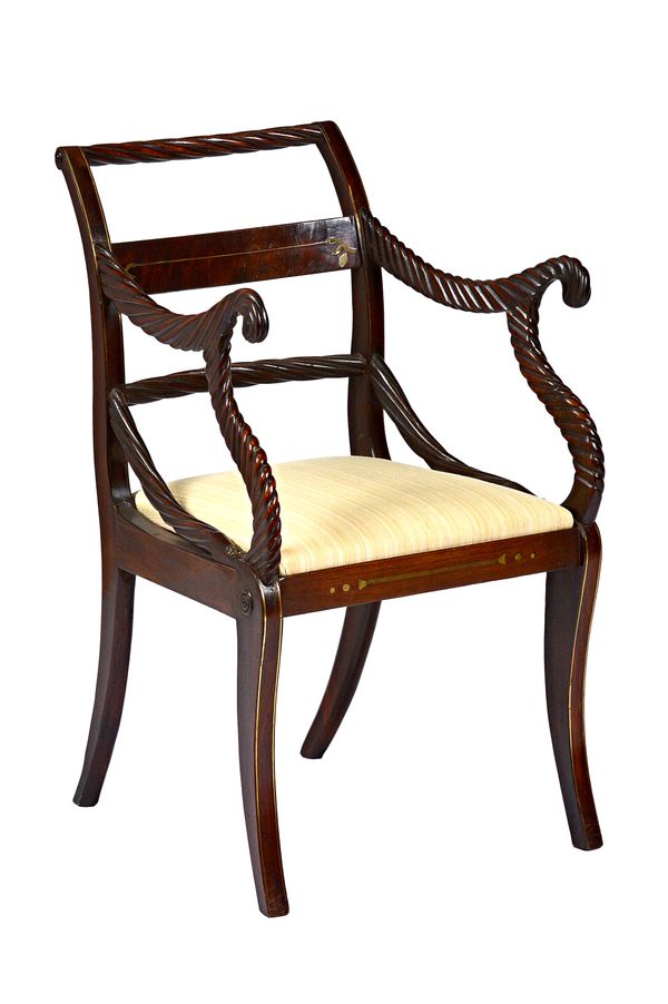 A set of eight Regency 'Trafalgar' brass inlaid mahogany dining chairs, with rope-twist carved frames and sabre supports, to include a pair of carvers
