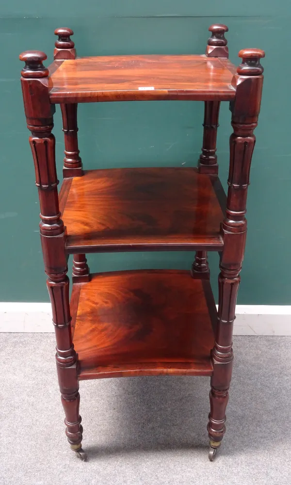 A William IV mahogany and rosewood square three tier whatnot on lappet supports, 52cm wide x 122cm high.