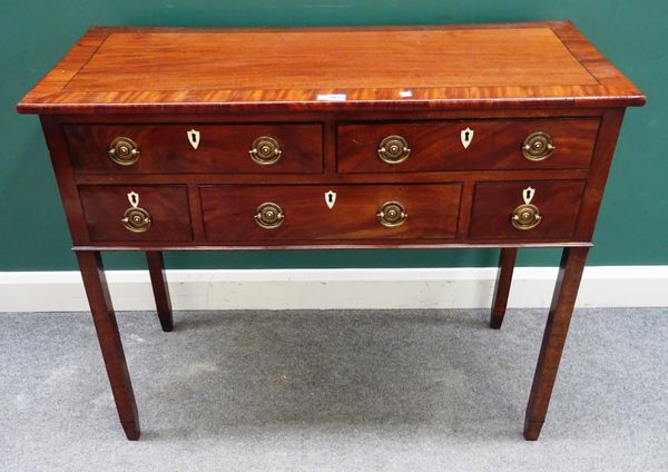 A George III crossbanded mahogany sideboard with five frieze drawers on block supports, 110cm wide x 90cm high x 47cm deep.