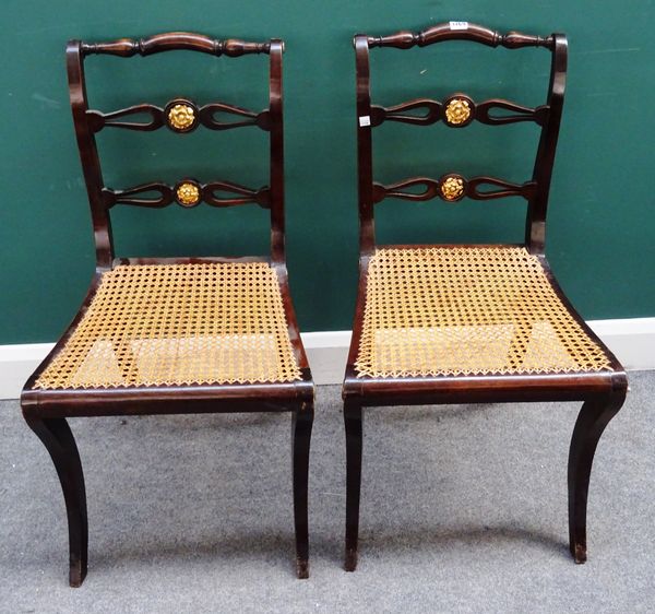 A set of six Regency parcel gilt stained beech dining chairs, each with double pierced waist rail on cabriole supports, 45cm wide x 87cm high (6).