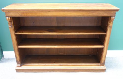 A Victorian figured walnut floor standing open bookcase with acanthus scroll mounts on plinth base, 154cm wide x 108cm high x 41cm deep.