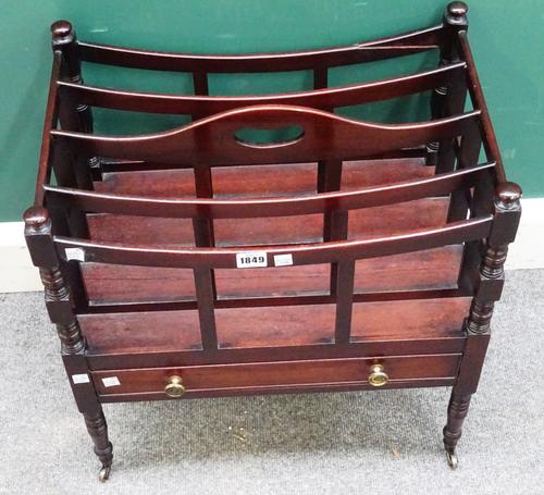 A Regency mahogany Canterbury, with concave four division top over a single drawer, on turned supports, 50cm wide x 53cm high x 35cm deep.