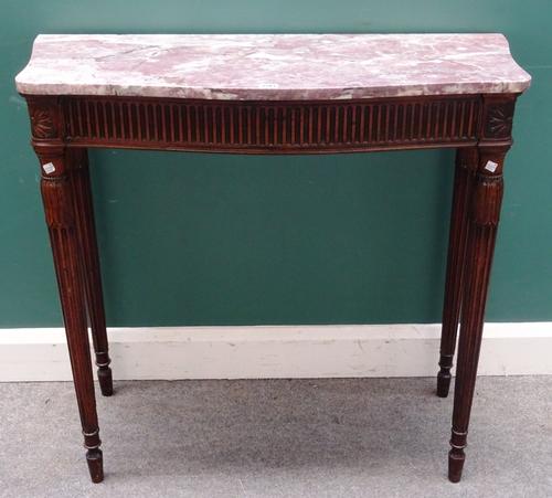 A 19th century console table, the serpentine marble top over a carved mahogany base on tapering fluted supports, 96cm wide x 89cm high x 44cm deep.