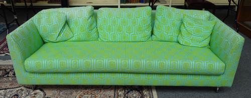 DESIGNERS GUILD FURNITURE; a 20th century twin tone green upholstered square back sofa, on chrome supports, 213cm wide x 67cm high.