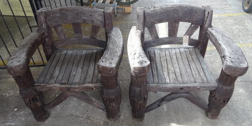 A pair of heavyset reclaimed cartwheel open arm garden chairs, 88cm wide x 84cm high (2).