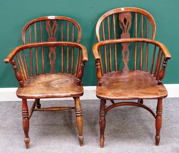 An early 19th century ash and elm bow back Windsor chair on turned supports united by crinoline stretcher, 54cm wide x 89cm high, together with anothe