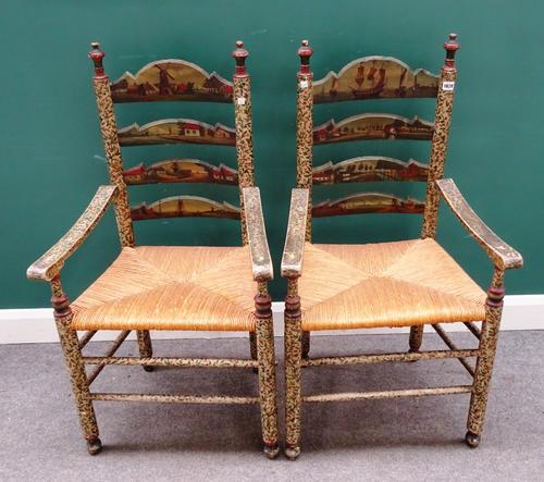 A pair of 19th century Dutch ladder back open armchairs, polychrome painted with landscape scenes and floral sprays, 58cm wide x 111cm high (2).