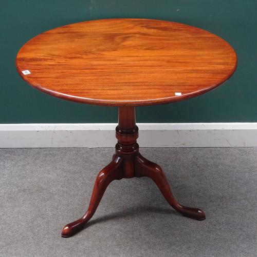 A mid-18th century mahogany occasional table, the circular snap-top on birdcage mount and tripod base, 84cm diameter x 75cm high.