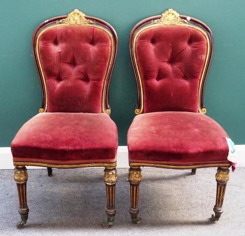 G HILL; a pair of mid-19th century parcel gilt mahogany framed side chairs, with shell crest and bow seat, on acanthus capped fluted supports, stamped