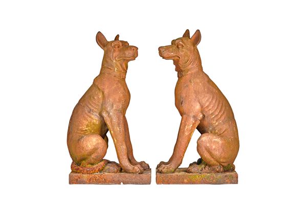 A pair of cast iron figures of seated hounds, on rectangular bases, 102cm high x 39cm wide (2). Illustrated