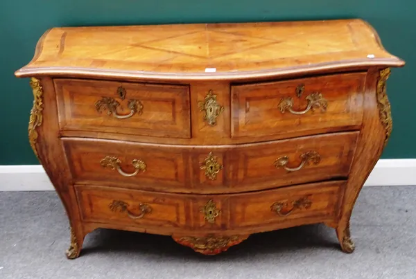 A Louis XV style gilt metal mounted walnut bombe commode of two short and two long drawers on splayed bracket feet, 132cm wide x 56cm deep x 86cm high