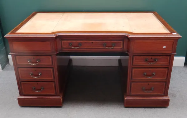 Maple & Co; a late 19th century inlaid mahogany pedestal desk, the inverted break front top over seven drawers about the knee, 152cm wide x 79cm high