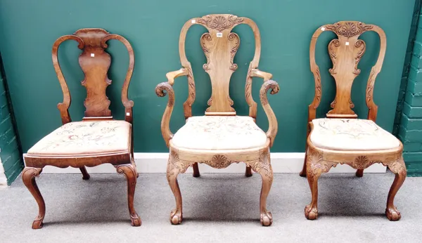 A George I style carved walnut vase back open arm chair with eagle head terminals and a bow seat on claw and ball feet, 68cm wide x 106cm high, togeth