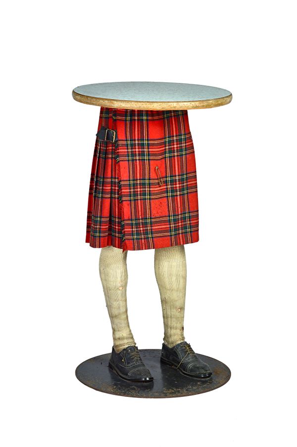 Primo Furniture Plc; a novelty serving table, the circular faux marble top on a kilt dressed mannequin base, 60cm deep x 108cm high. Illustrated