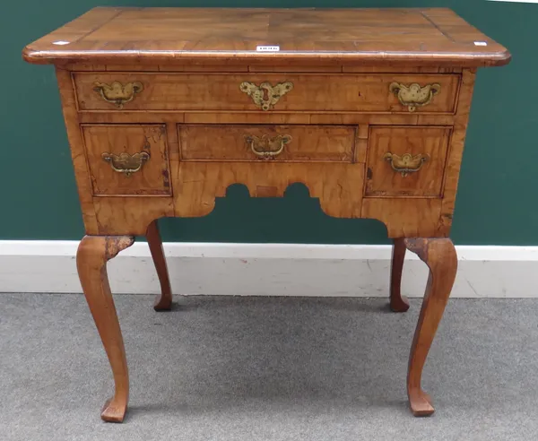 A mid-18th century walnut lowboy with five frieze drawers on square cabriole supports, 71cm wide x 44cm deep x 70cm high.