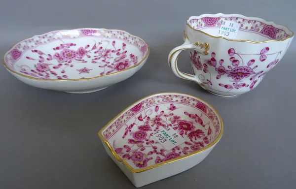 A Meissen part tea service, 20th century, decorated in a gilt pink floral pattern, comprising; six teacups, six saucers and a small horse shoe shaped