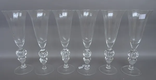 A set of six Italian champagne flutes, mid 20th century, with outswept bowl and fluted knopped stem, 24cm. (6)