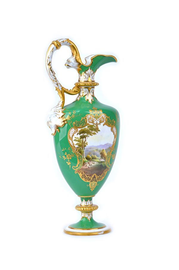 A Royal Worcester green -ground ewer, circa 1903, the shield-shaped body painted by Harry Davis, signed, with a shepherd and flock of sheep in a lands