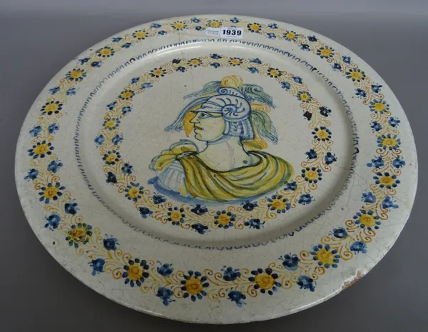 An Italian maiolica charger, 20th century, centred with a Roman warrior figure within a wide foliate border, 42cm diam, boxed.