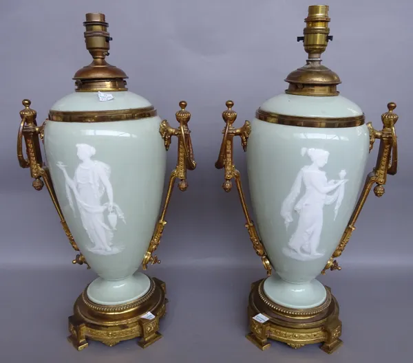 A pair of French pate- sur- pate ormolu mounted oil lamps bases (converted), late 19th century, possibly decorated by Fernand Paillet depicting Grecia