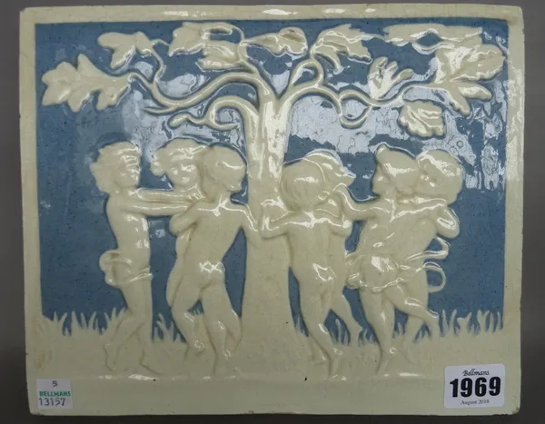 A Della Robbia style pottery plaque, late 19th century/20th century, depicting putti dancing around a tree, incised marks to rear, 25cm x 20cm.