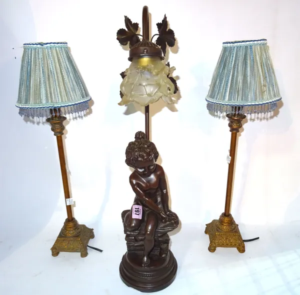 A 20th century faux bronze lamp formed as a young girl and a pair of Regency style lamps on acanthus plinth bases, (3).   S2B