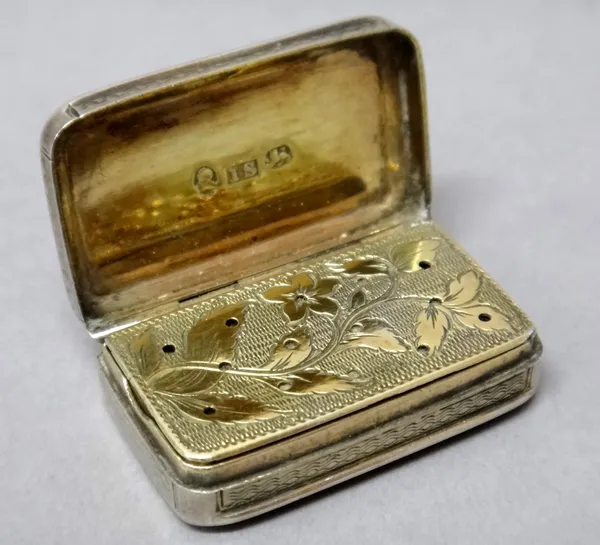 A George III silver rectangular vinaigrette, with a gilt floral and foliate pierced grille, the exterior engine turned, Birmingham 1812, weight 17.6 g