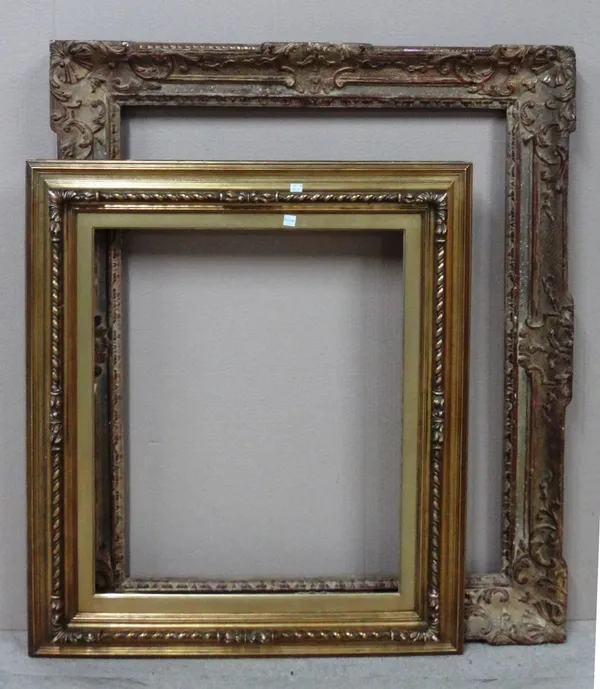 An 18th century style gilt frame, aperture 67cm x 82cm.; together with an early 20th century gilt plaster frame, aperture 61cm x 51cm.(2)  BAY 3
