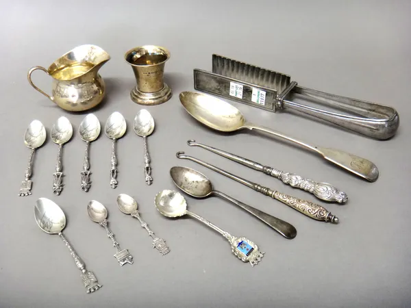 Silver and silver mounted wares, comprising; a milk jug, London 1937, a fiddle pattern tablespoon, London 1856 and a teaspoon, combined weight 152 gms