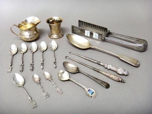 Silver and silver mounted wares, comprising; a milk jug, London 1937, a fiddle pattern tablespoon, London 1856 and a teaspoon, combined weight 152 gms