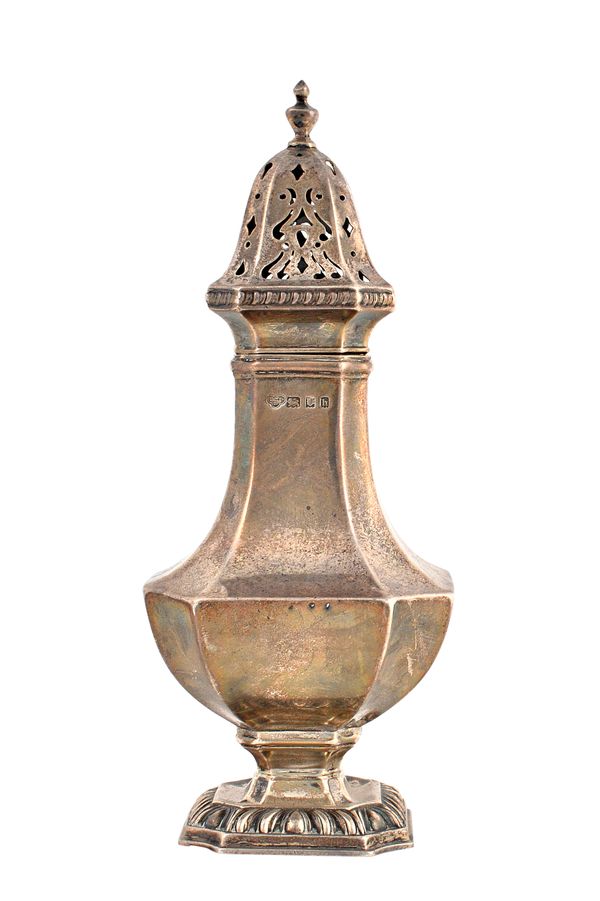 A silver sugar caster of tapered angular baluster form, having a decorated rim, raised on a cut cornered square base, 21cm high, London 1923, weight 2