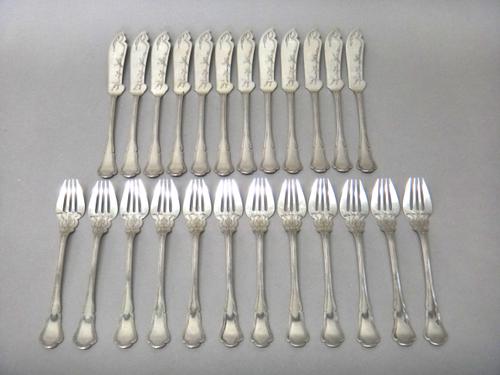 A set of twelve pairs of foreign fish knives and forks, with engraved decoration, detailed 800, combined weight 1225 gms.