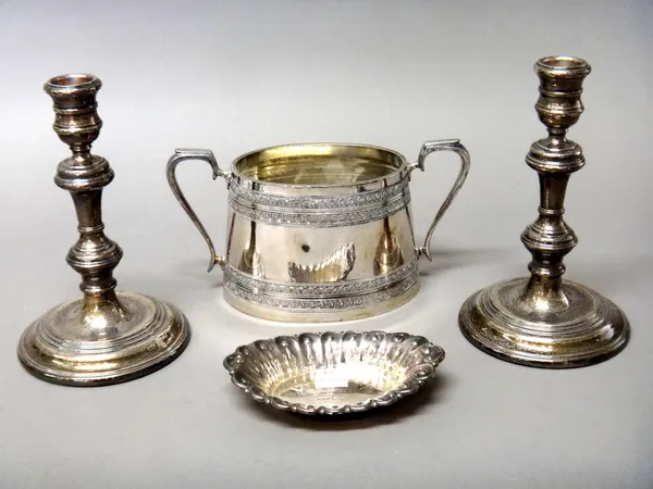 A pair of silver table candlesticks, raised on circular bases, by Mappin & Webb, London 1978, height 16cm, (loaded), a silver oval bonbon dish, decora