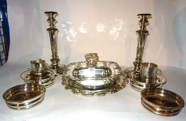 Silver plated wares, including; a pair of embossed table candlesticks, two pairs of bottle coaters, an entree dish and cake stand, (qty).  S4T