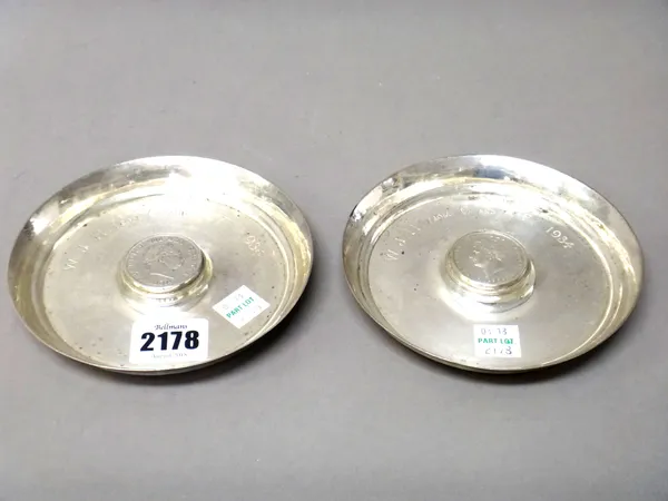 Two silver circular dishes, one mounted to the centre, with a George III half crown 1819 and the other mounted to the centre with a George IV half cro