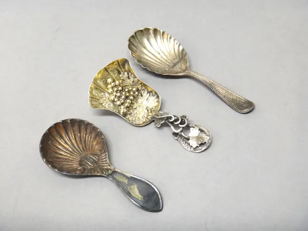 A Victorian silver gilt tea caddy spoon, the shovel shaped bowl embossed with fruiting vine, the handle of entwined vine leaf form, Birmingham 1852 an