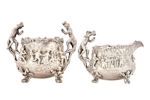 A Victorian silver composite four piece tea and coffee service, decorated in the Teniers revival style, each piece decorated with merry making figures