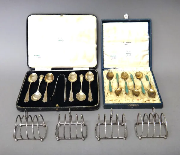 Silver, comprising; a five bar toastrack, with a loop shaped handle, London 1937, three similar toastracks, London 1938 and a set of six teaspoons wit