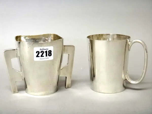 An Irish silver twin handled christening mug of tapered form with angular handles, presentation inscribed, height 9cm, Dublin 1901, weight 181 gms and