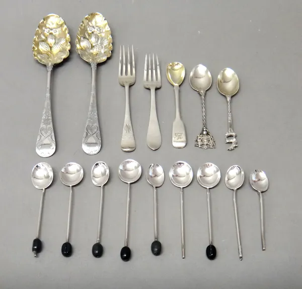 Silver flatware, comprising; a pair of berry fruit serving spoons, the gilt bowls decorated with flowers and fruits and with engraved decoration to th