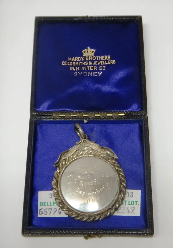 An Australian prize medal, of circular form, having a ropetwist border and with a foliate suspension, engraved to one side Sydney Public High School,