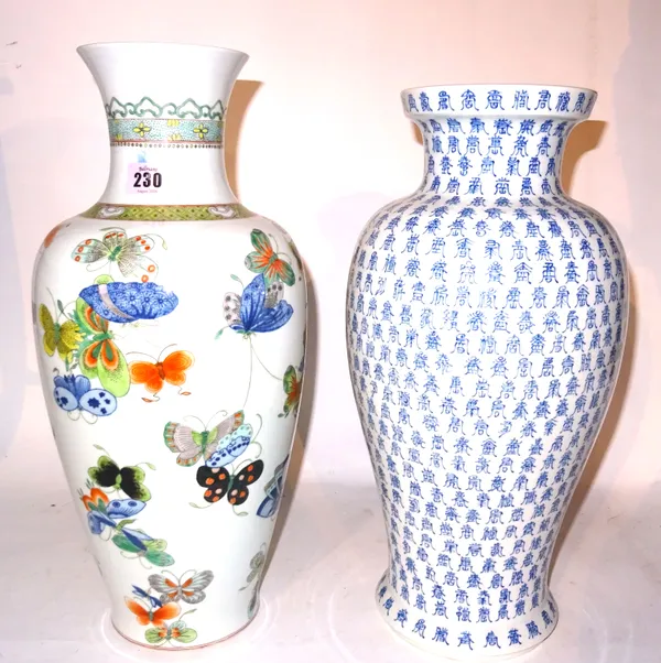 A 20th century blue and white vase decorated with repeating Chinese characters, six character mark to base and a famille verte Chinese vase decorated